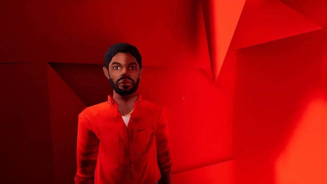 Un hombre con gafas y un botón rojo se encuentra frente a un fondo rojo.